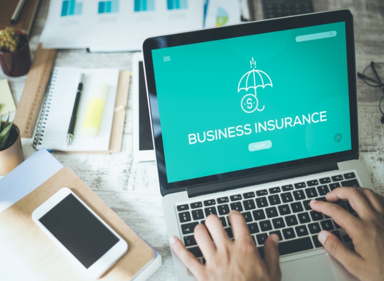 Business owner reviewing liability insurance policy documents in Palm Bay, FL